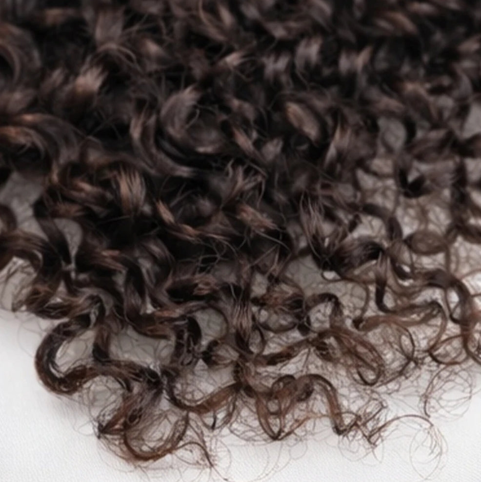 Miracle Knots human feather crochet hair by Celebrity Hair & Beauty with Burmese curly texture and no spiral ends.