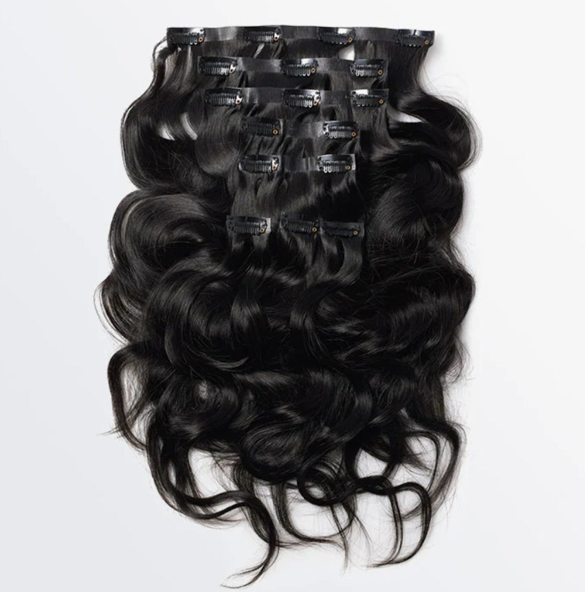 Celebrity Hair & Beauty 18-22 inch body wave seamless clip-in hair extensions, showing smooth, natural-looking hair with clips attached.