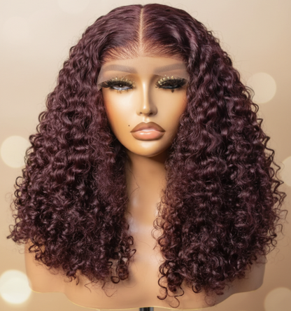 250% density kinky curly raw human hair wig in burgundy 99J with honey blonde highlights.