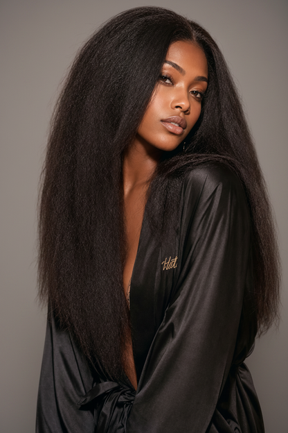 Model with long kinky straight hair showcasing Raw Kinky Straight K Tip Bundles.