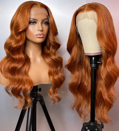 Celebrity Hair & Beauty body wave wig with 210% density, 13x6 HD frontal lace, in orange/ginger color, extensions visible in the image.