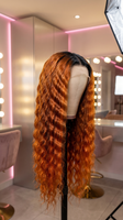 Brazilian Remy human hair lace front extensions in ginger and orange deep wave, pre-plucked for a natural look from Celebrity Hair & Beauty.
