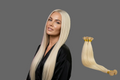 Celebrity Hair & Beauty I Tip Hair Extensions in natural Remy human hair, light blonde (#613) with mint green tips, styled for length and volume.