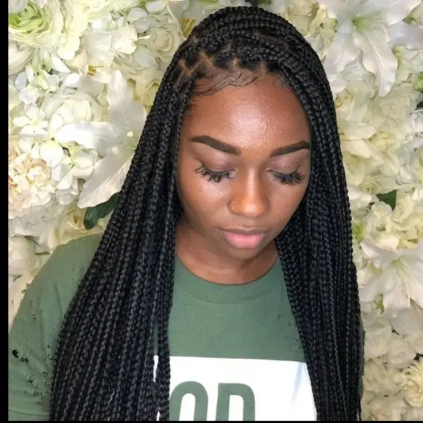 Woman wearing glueless knotless lace-front wig with micro cornrow box braids, 32-inch heat-resistant synthetic hair