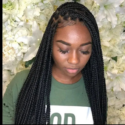 Woman wearing glueless knotless lace-front wig with micro cornrow box braids, 32-inch heat-resistant synthetic hair