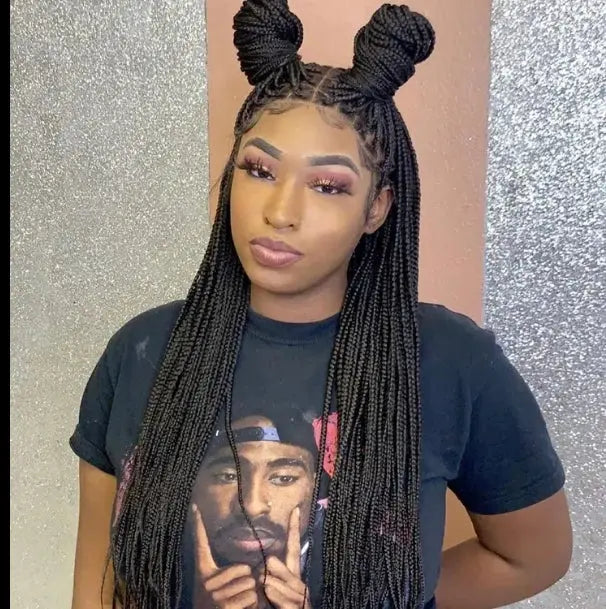 Woman wearing a 32-inch handmade micro cornrow box braided wig with glueless knotless lace front, synthetic hair.