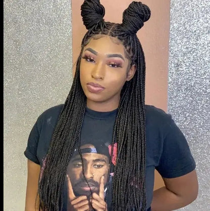Woman wearing a 32-inch handmade micro cornrow box braided wig with glueless knotless lace front, synthetic hair.