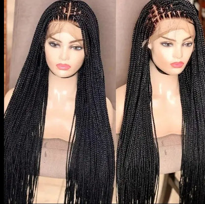 Two mannequin heads wearing 32-inch handmade micro cornrow box braided lace-front wigs, glueless knotless braids.