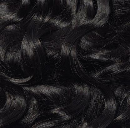 Celebrity Hair & Beauty 18 to 22-inch body wave seamless clip-in hair extensions displayed on a model's hair.