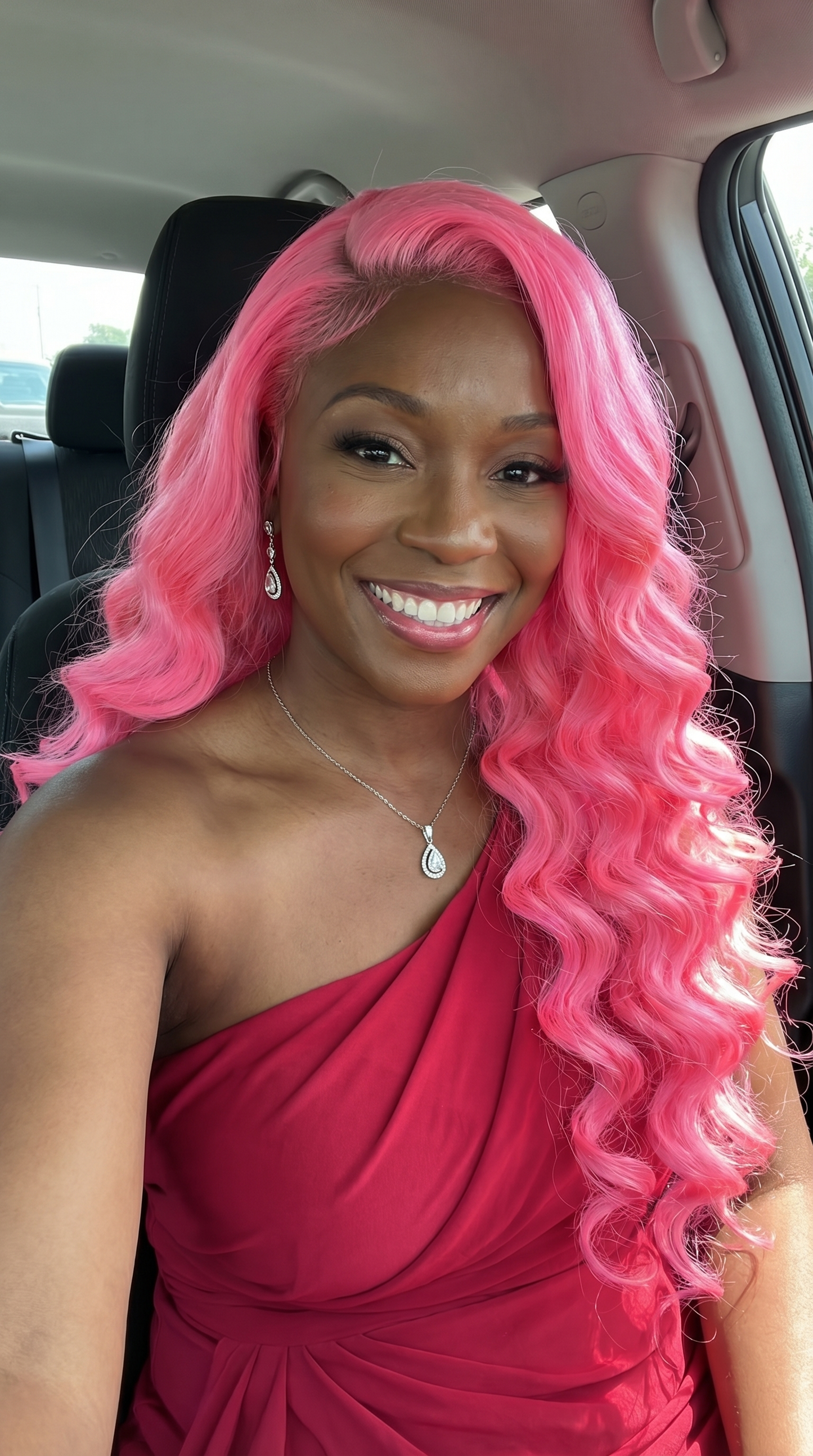 Baby pink loose wave 28-inch TP lace wig by Celebrity Hair & Beauty, showcasing soft, flowing wavy hair on a mannequin head.